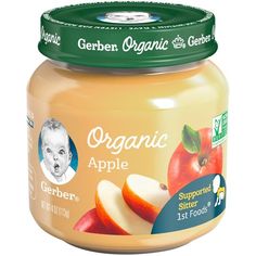 an open jar of organic baby food with apples on the top and in the bottom