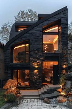 a modern house with stone steps leading up to it