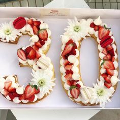 the number 50 is decorated with strawberries and flowers