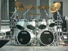 a set of drums sitting on top of a stage