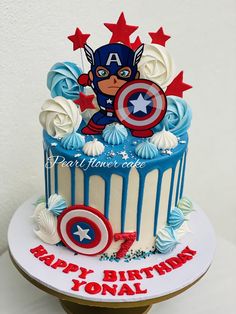 the birthday cake is decorated with captain america decorations