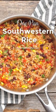 one pan southwestern rice with black beans and corn in a skillet on a wooden table