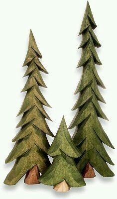 three wooden trees are standing next to each other