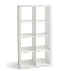 a white bookcase with four shelves on each side