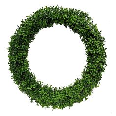 a circular wreath made out of green leaves