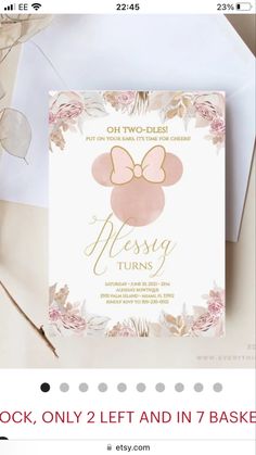 a pink and gold minnie mouse birthday party card with flowers on the front, featuring a bow