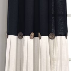 black and white curtains with buttons on them