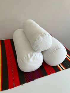 three pillows stacked on top of each other