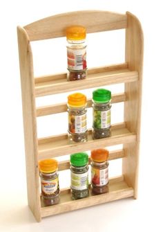 a wooden spice rack with spices on it