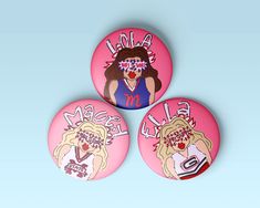 three pink buttons with images of women's faces and words that say, make me smile