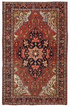 an antique persian rug with red and blue colors