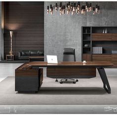 an office desk with a laptop on it