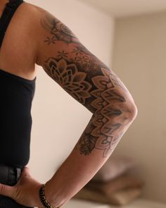 a woman with a tattoo on her arm