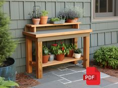 a potted plant on top of a wooden bench