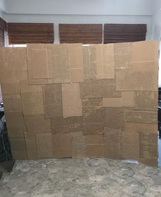 a pile of cardboard sitting on top of a counter