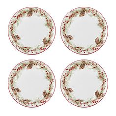 four red and white plates with pine cones on the rims, decorated with holly