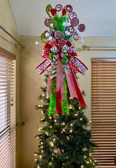 a christmas tree decorated with candy canes and bows