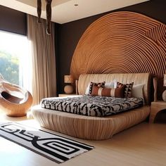 a large bed sitting in the middle of a bedroom next to a wooden chair and window