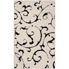 a rug with black and white designs on it