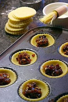 a muffin tin filled with cupcakes covered in jelly