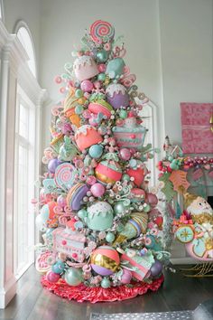 a colorful christmas tree with lots of ornaments