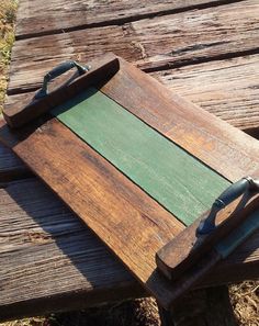 a wooden cutting board sitting on top of a wooden bench