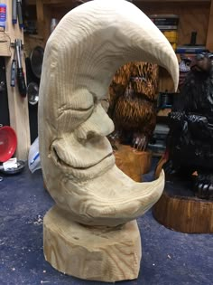 a sculpture of a man's face is being worked on