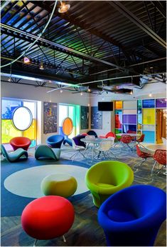 colorful chairs and tables in an office setting