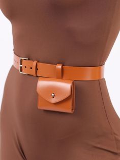 Made in a modern and minimalist aesthetic, the Micro Belt Bag is not only a fashion accessory but also a functional one. Although small, the stylish bag can hold your keys, coins or other small items. With its versatile design, the leather belt bag can be worn with a sporty jumpsuit for an edgy outfit or with a blazer for a chic, elegant look. Bag Size: Height- 7 cm, Width- 8 cm, Depth – 1.5 cm Waist belt width: 3 cm Adjustable using the front buckle Designed to be fitted on the waist Paraprofessional Outfits, Belt Bag Outfit, Waist Bag Leather, How To Make Leather, Womens Leather Belt, Leather Waist Bag, Gifts For Girlfriend, Christmas Gifts For Girlfriend, Leather Belt Bag