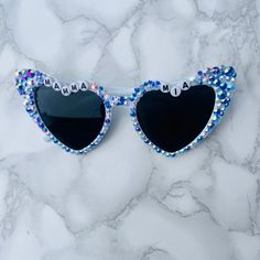 The perfect statement accessory for anything abba themed!  Mamma Mia, here we go again! Abba Voyagr or an Abba themed birthday party! Make a statement in these sparkly Greek blue sunglasses!  Other variations available in my Etsy shop and they can be personalised with any wording if your choice! Mamma Mia Party Accessories, Abba Voyage Concert Outfit Ideas, Fun Blue Sunglasses For Party, Fun Blue Sunglasses For Parties, Mamma Mia Activities, Playful Blue Sunglasses For Party, Playful Blue Party Sunglasses, Trendy Blue Sunglasses As Gift, Trendy Blue Sunglasses For Gift