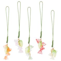 four necklaces with flowers and leaves on them