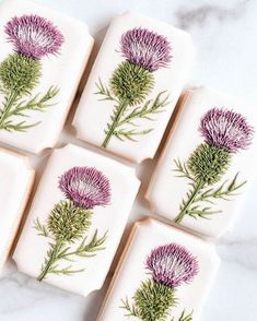 four soap bars with purple flowers on them