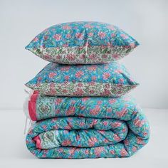 three pillows stacked on top of each other