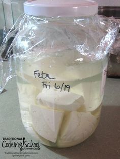 a jar filled with liquid sitting on top of a counter