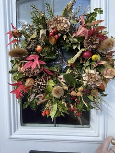 a wreath is hanging on the front door