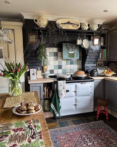 a kitchen filled with lots of counter space and decor on top of it's counters