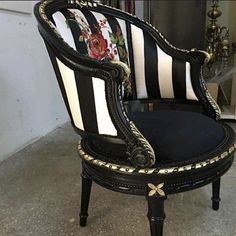 a black and white striped chair with flowers on it