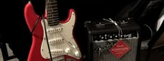 an electric guitar and amp sitting next to each other