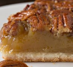 a slice of pecan pie on a white plate