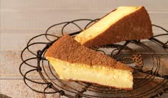 two pieces of cake sitting on top of a wire rack