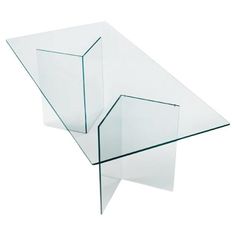 a glass table that is shaped like an upside down triangle