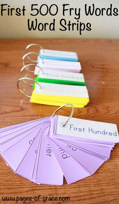 four different colored cards with the words first 500 fry words word strips