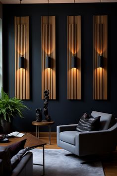 a living room with black walls and wooden paneling on the wall, along with two gray couches