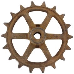 an old rusted metal sprock wheel on a white background