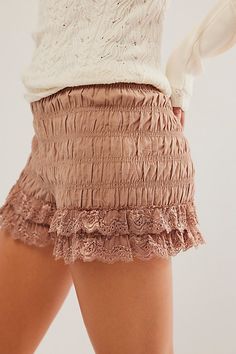 So femme and frilly, these bloomer-inspired shorts are featured in a soft cotton fabrication and high-rise fit with gathered detail throughout and lace-adorned hemlines. **Fit:** High-rise, slim-fitting **Features:** Soft cotton fabrication, gathered detail throughout, stretchy elastic waistband, gathered detail throughout, ruffled-adorned hemlines **Why We | In Bloom Shorties by Intimately at Free People in Brown, Size: S Cotton Shorts With Ruffle Hem, Cotton Ruffle Shorts For Loungewear, Cotton Ruffled Short Bloomers, Summer Ruffled Bloomers For Daywear, Chic Lace Trim Shorts For Spring, Chic Spring Shorts With Lace Trim, Bohemian Shorts With Ruffles, Spring Loungewear Bloomers In Short Length, Cotton Bottoms With Ruffle Hem For Daywear