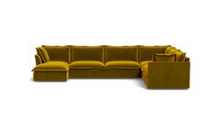 a yellow couch with pillows on top of it