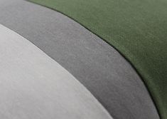 closeup of an umbrella with green and grey stripes