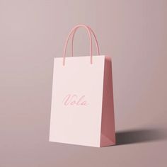 a pink shopping bag with the word vale printed on it's front and side