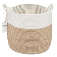 a large white and beige basket with rope on the bottom, in front of a white background