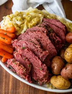 corned beef, potatoes and carrots on a plate